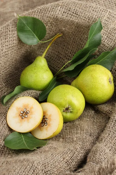 Juicy flavorful pears on sackcloth — Stock Photo, Image