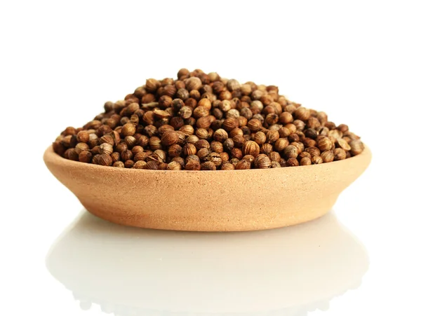Heap coriander seeds in clay bowl isolated on white — Stock Photo, Image