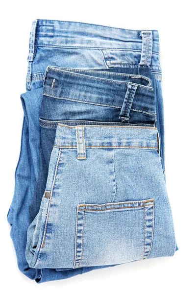 Vários jeans de moda azul isolado no branco — Fotografia de Stock