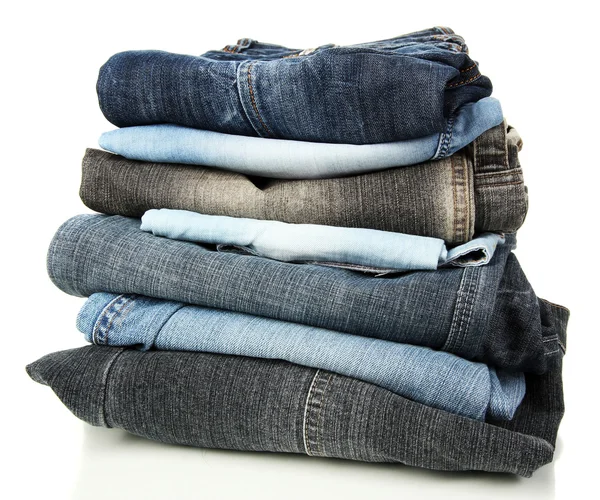 Veel verschillende jeans geïsoleerd op wit — Stockfoto