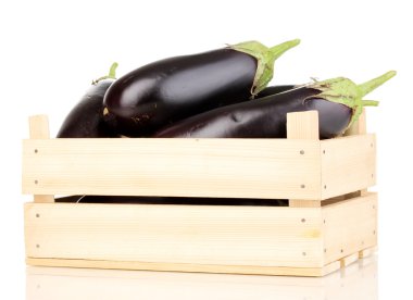 Fresh eggplants in crate isolated on white clipart