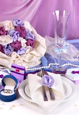 Serving fabulous wedding table in purple color on white and purple fabric b