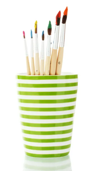 Paint brushes with gouache in cup isolated on white — Stock Photo, Image