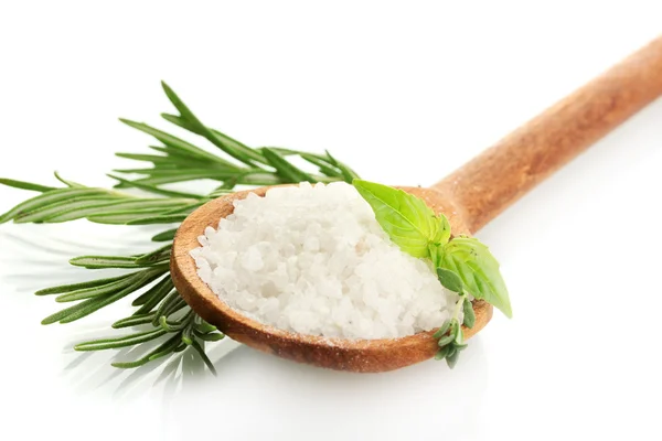 Salt in spoon with fresh basil, thyme and rosemary isolated on white — Stock Photo, Image