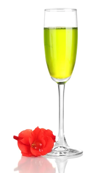 Glass with cocktail and gladiolus bud isolated on white — Stock Photo, Image