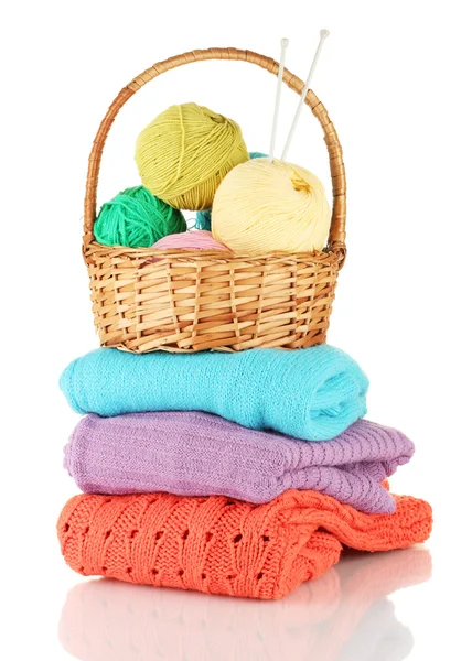 Sweaters and balls of wool isolated on white — Stock Photo, Image