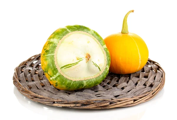 Two pumpkins on wicker mat isolated on white — Stock Photo, Image