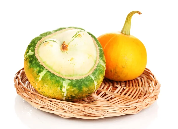 Two pumpkins on wicker mat isolated on white — Stock Photo, Image