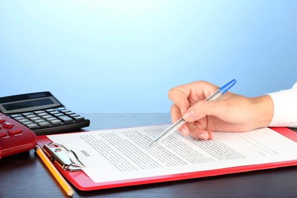 Signing of a treaty, on blue background close-up — Stock Photo, Image