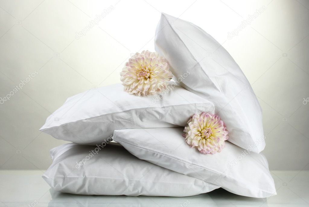 pillows and flowers, on grey background