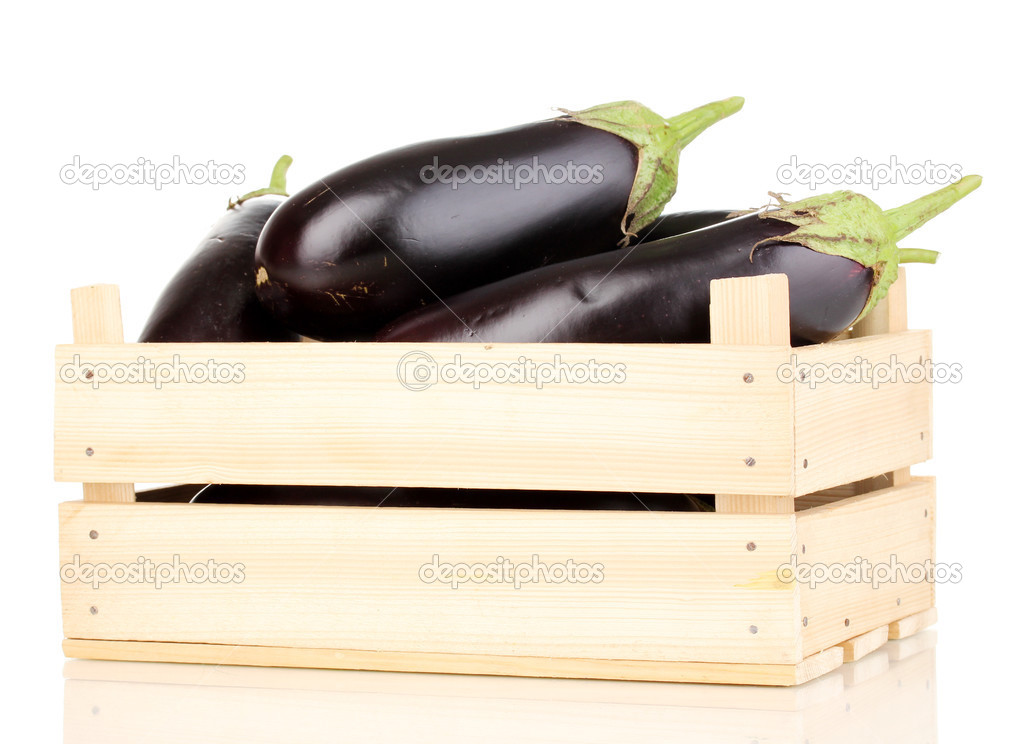 Fresh eggplants in crate isolated on white