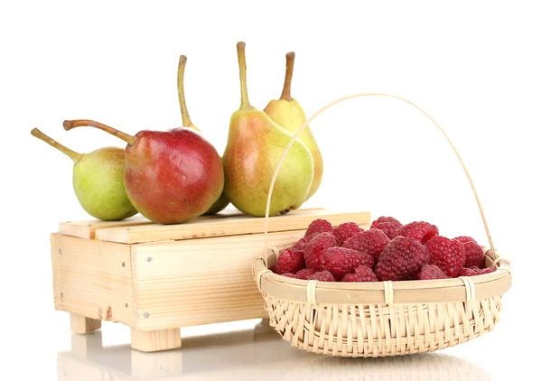 Ripe raspberries in basket and pears on crate isolated on white — Stock Photo, Image