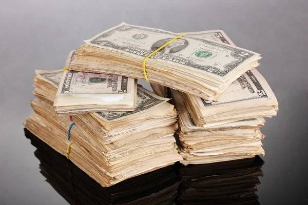 Stacks of dollars on black background — Stock Photo, Image