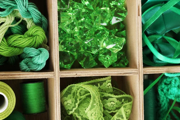 Green thread and material for handicrafts in box close-up — Stock Photo, Image