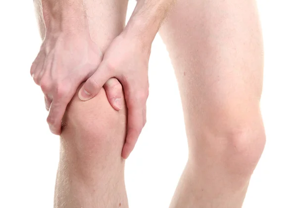 Hombre sosteniendo dolor de rodilla, aislado en blanco — Foto de Stock