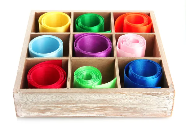 Bright silk ribbons in wooden box, isolated on white — Stock Photo, Image