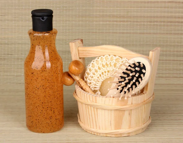 Bathroom set with scrub on bamboo background — Stock Photo, Image