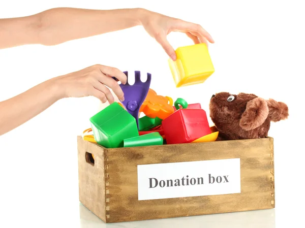 Donation box with children toys on white background close-up — Stock Photo, Image