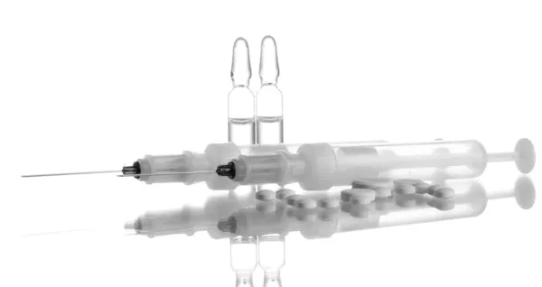 Syringes monovet, ampoules and pills isolated on white — Stock Photo, Image