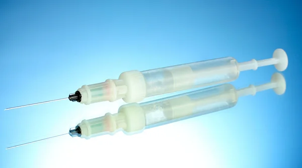 Syringe monovet on blue background — Stock Photo, Image