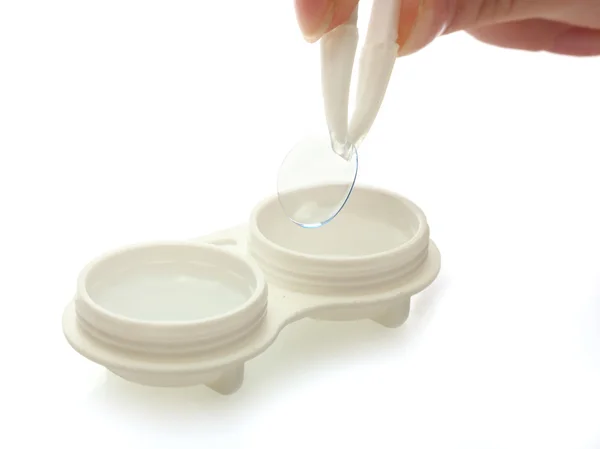 Contact lenses in containers and tweezers, isolted on white — Stock Photo, Image