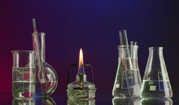 spiritlamp and test-tubes on blue-red background