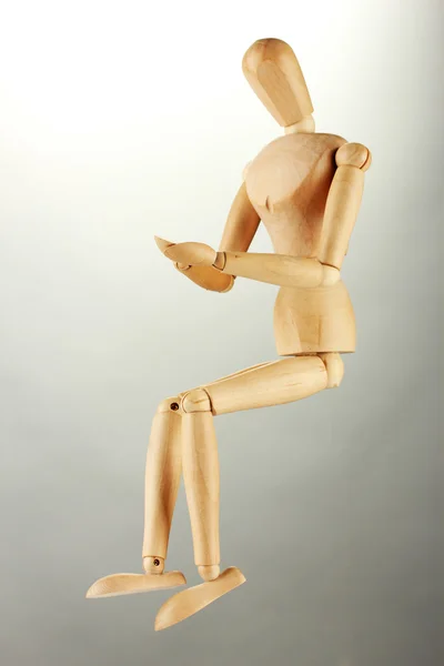 Wooden mannequin, on grey background — Stock Photo, Image