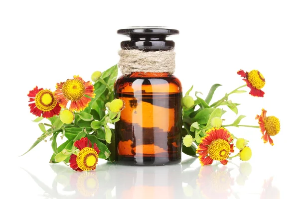 Medicine bottle and flowers isolated on white — Stock Photo, Image