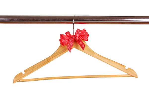 Beautiful red bow hanging on wooden hanger isolated on white — Stock Photo, Image