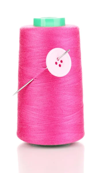 Pink bobbin with needle and buttons isolated on white — Stock Photo, Image