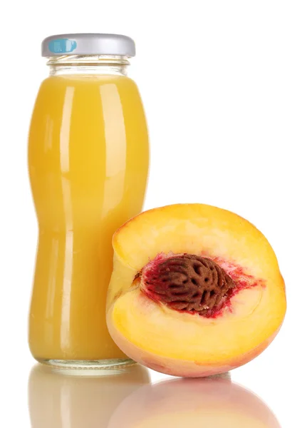 Delicious peach juice in glass bottle and peach next to it isolated on whit — Stock Photo, Image