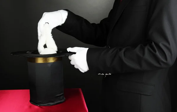 Magician performance on dark background — Stock Photo, Image