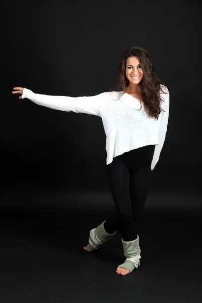 Young modern dancer posing, isolated on black — Stock Photo, Image