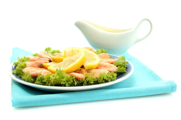 Boiled shrimps with lemon and lettuce leaves on plate and sauce, isolated o — Stock Photo, Image