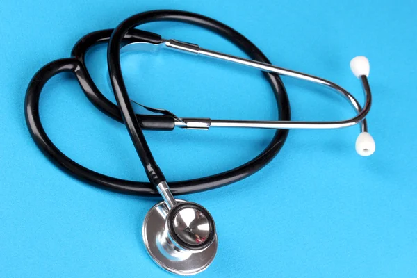 Stethoscope on blue background — Stock Photo, Image