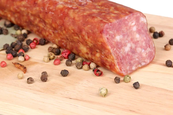 Tasty sausage on chopping board close-up — Stock Photo, Image