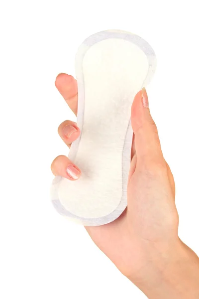 Woman's hand holding a daily sanitary pad on white background close-up — Stock Photo, Image