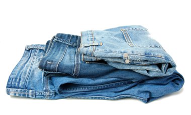 Several fashion blue jeans isolated on white
