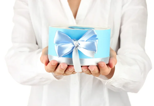 Woman holds a box with a gift on white background close-up — Stock Photo, Image