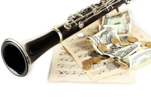 Strumento musicale con denaro isolato su bianco — Foto Stock