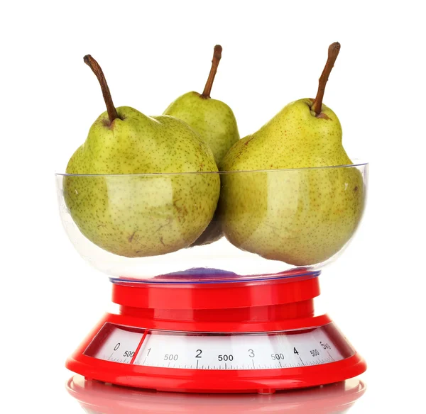 Ripe pears in kitchen scales isolated on white — Stock Photo, Image