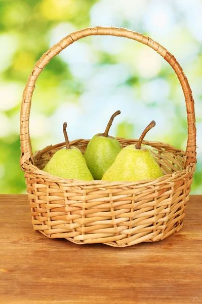 Ripe pears on colorful green background — Stock Photo, Image