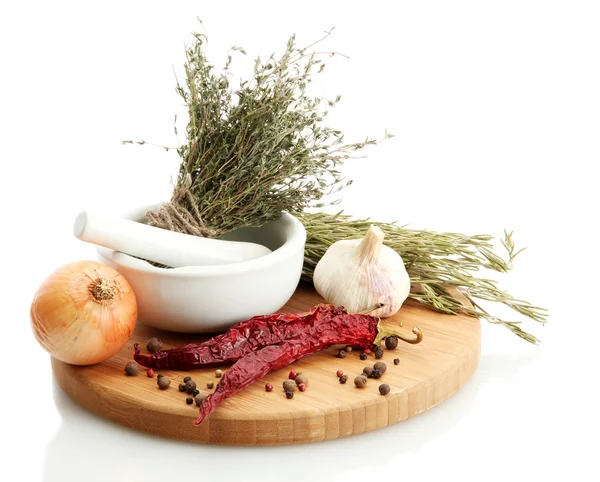 Dried herbs in mortar and vegetables, isolatrd on white — Stock Photo, Image