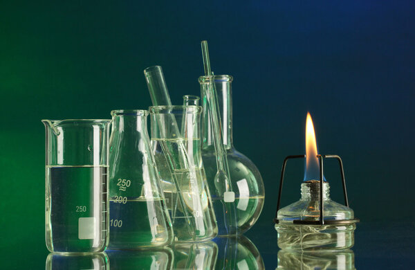 spiritlamp and test-tubes on blue-green background