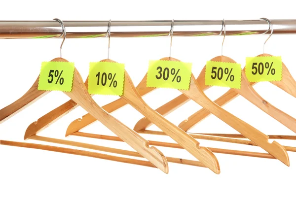 Wooden clothes hangers as sale symbol isolated on white — Stock Photo, Image