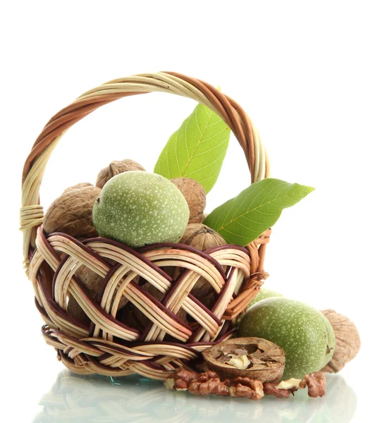 Walnuts with green leaves in basket, isolated on white — Stock Photo, Image