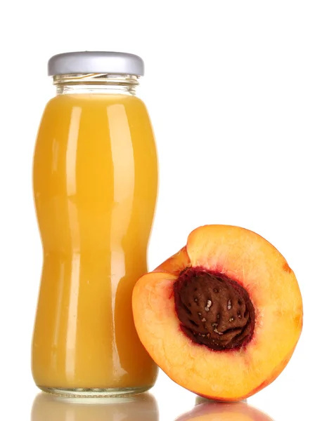 Delicious peach juice in glass bottle and peach next to it isolated on whit — Stock Photo, Image