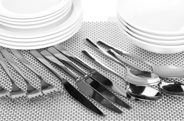 Forks, knifes and spoons on red mat close-up — Stock Photo, Image