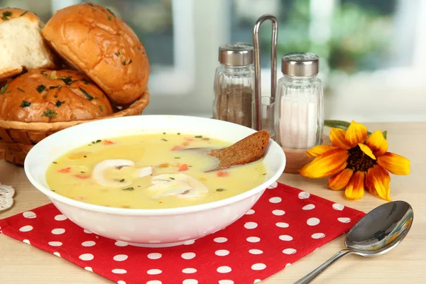 Fragrant soup in white plate on table on window background close-up — Stock Photo, Image