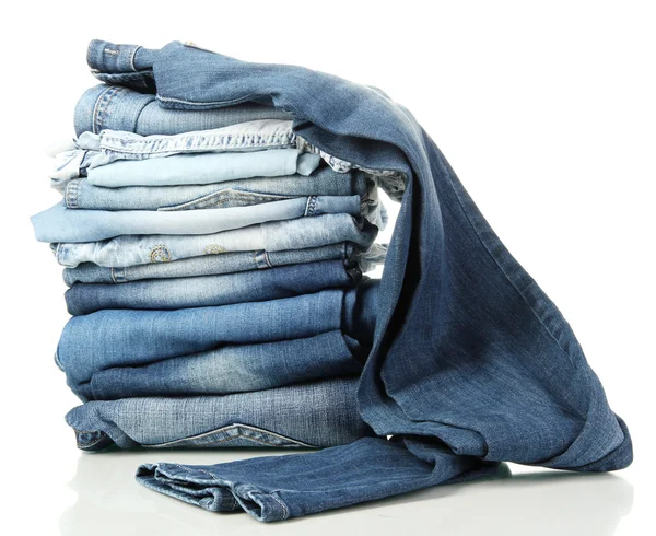 Lot of different blue jeans isolated on white — Stock Photo, Image